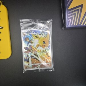 Jolteon Pokémon Card in Protective Sleeve